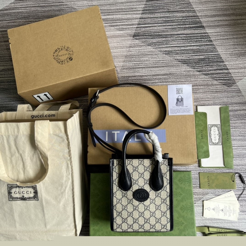 G*u*i top handle bags